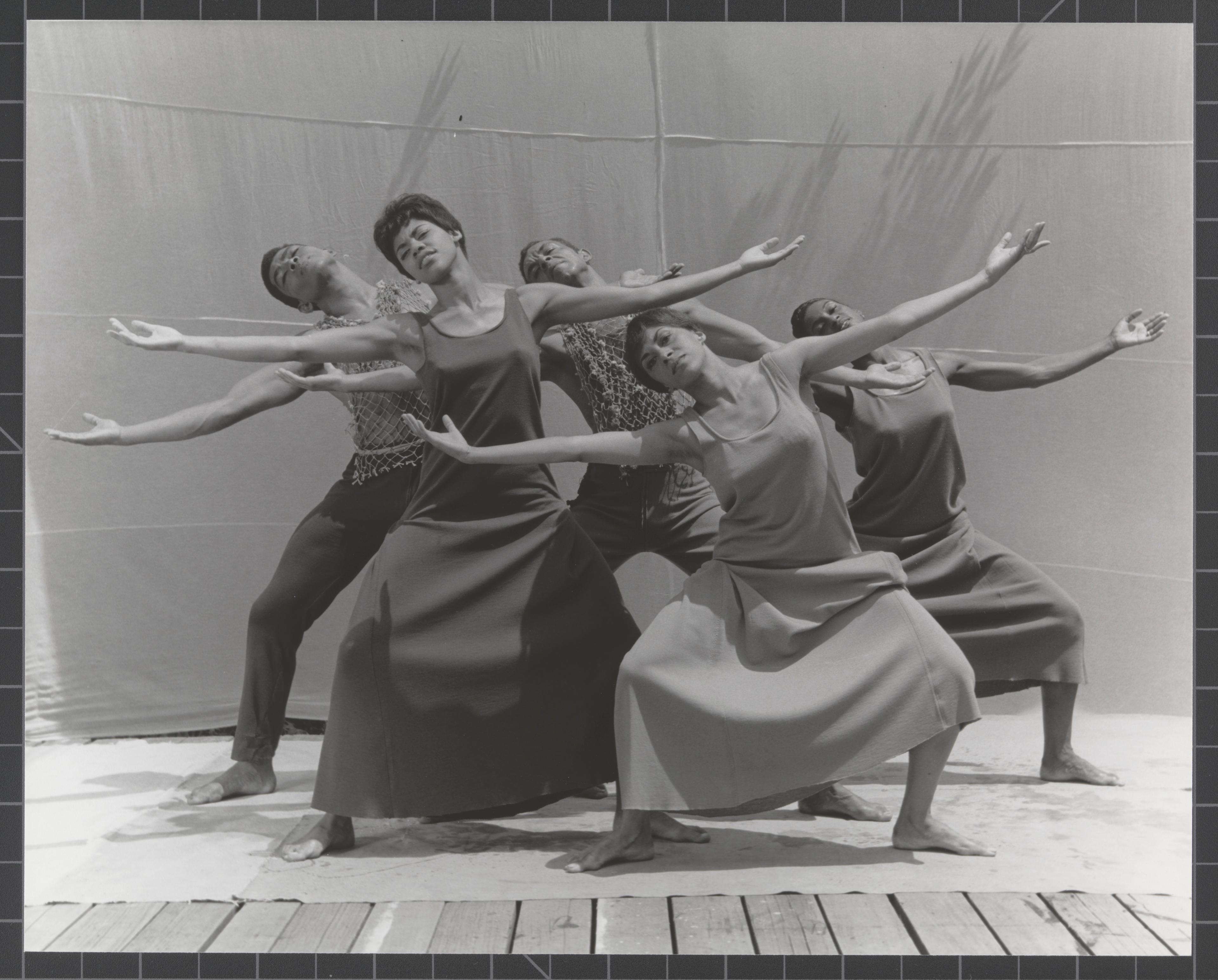 A black and white photo of 5 dancers in Revelations outside at Jacob's Pillow