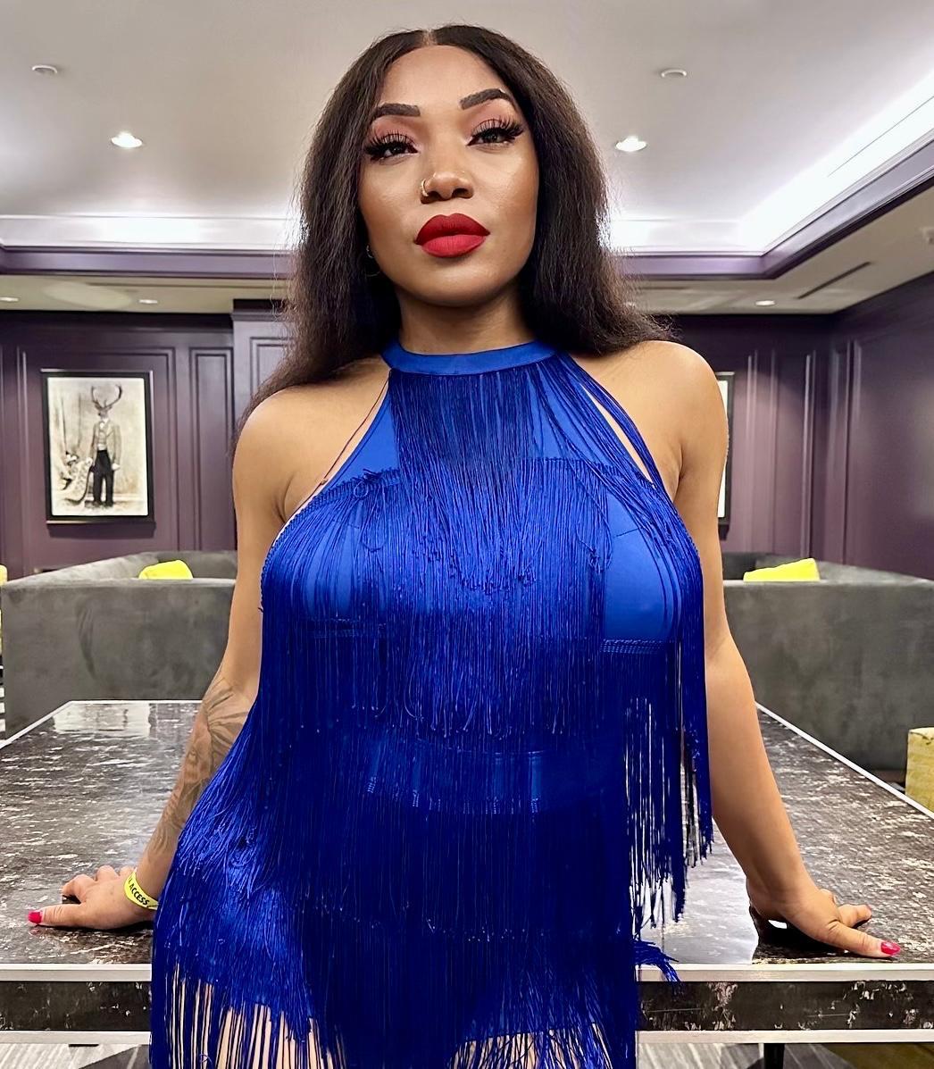 Instructor Judith McCarty in a short blue fringe dress